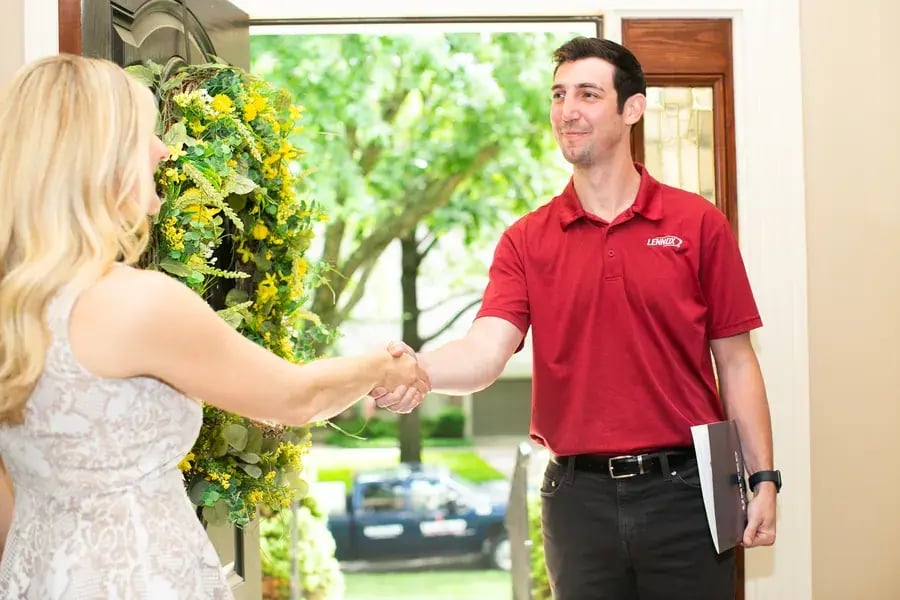 United Heating technician shaking hands with a Kansas City homeowner