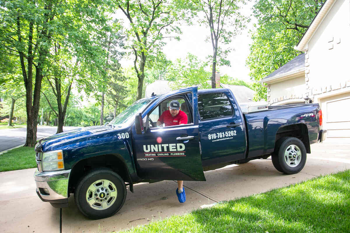 United Heating, Cooling & Plumbing technician arriving at a Kansas City home in a United truck