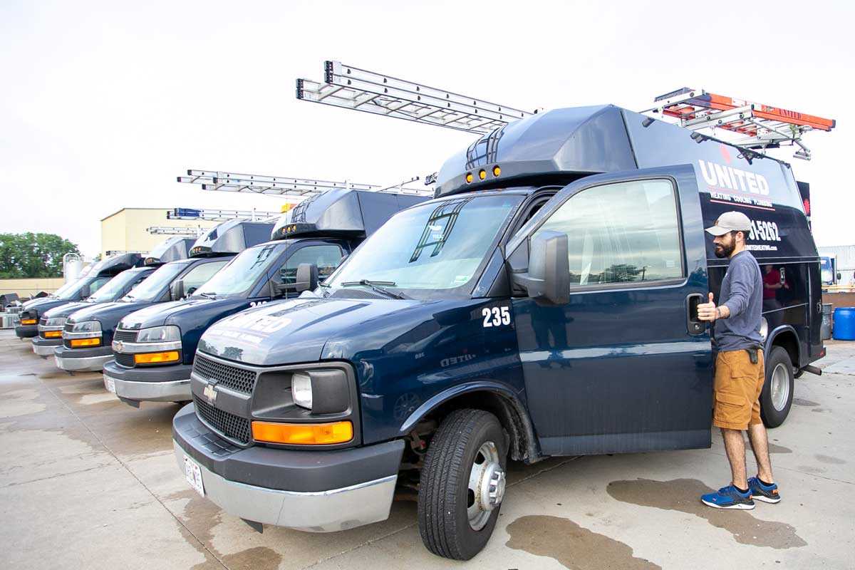 A United Heating and Cooling Technician On Their Way To Perform An Emergency AC Repair