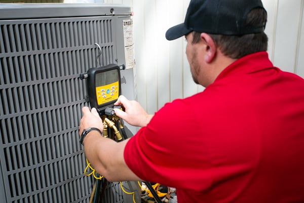 A United Technician Performing Expert AC Services in Kansas City